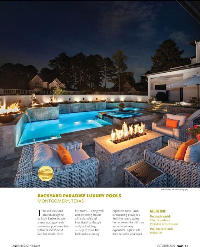 pool at night with fence, a fire pit, an outdoor pool, and a patio