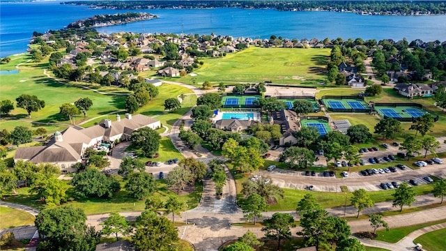 birds eye view of property featuring a water view, a residential view, and golf course view