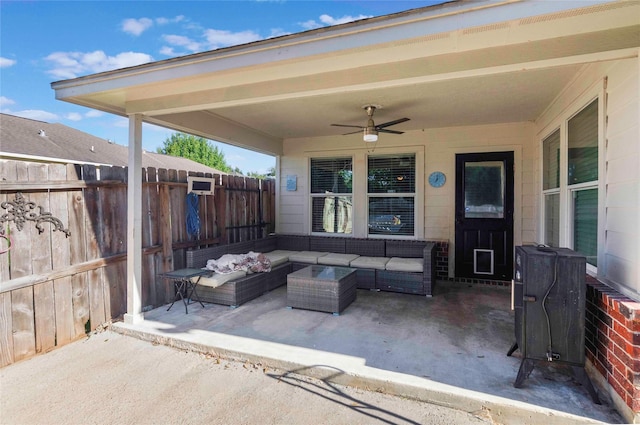 view of patio with outdoor lounge area, fence, and ceiling fan