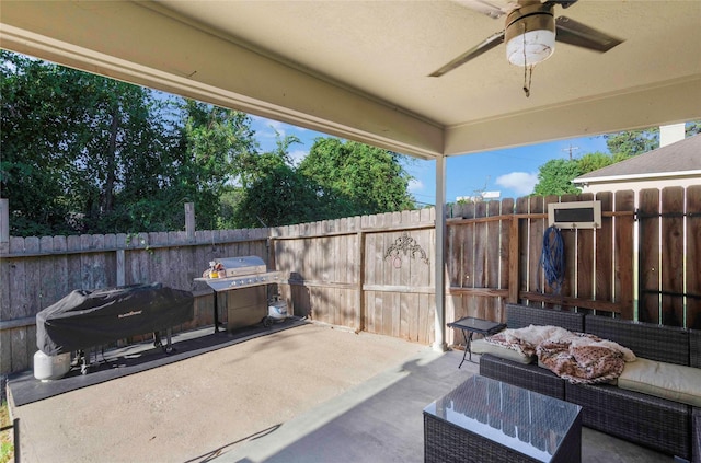 view of patio featuring ceiling fan, a grill, fence, and outdoor lounge area