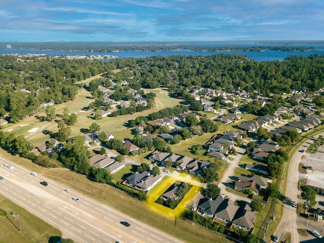 drone / aerial view with a residential view and a view of trees