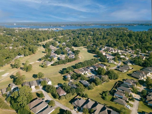 bird's eye view featuring a water view, a wooded view, and a residential view