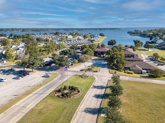 birds eye view of property featuring a water view and a residential view