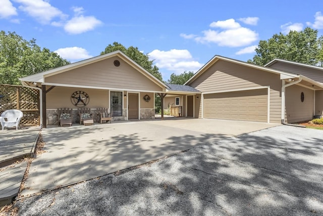 view of front of property with a garage and driveway