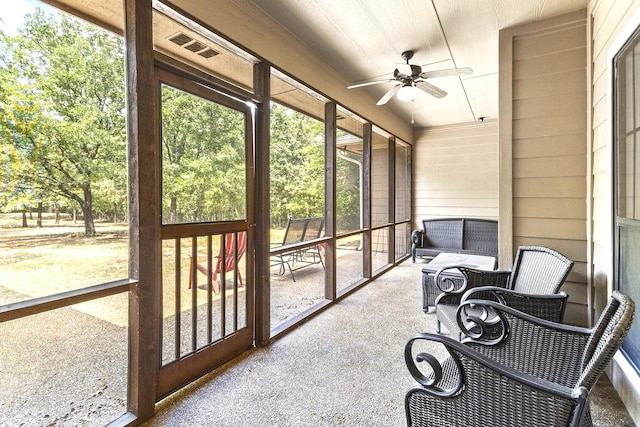 sunroom / solarium featuring ceiling fan and visible vents