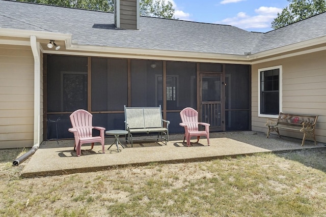 view of patio / terrace with a sunroom