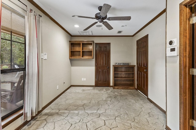 unfurnished bedroom featuring visible vents, crown molding, and baseboards