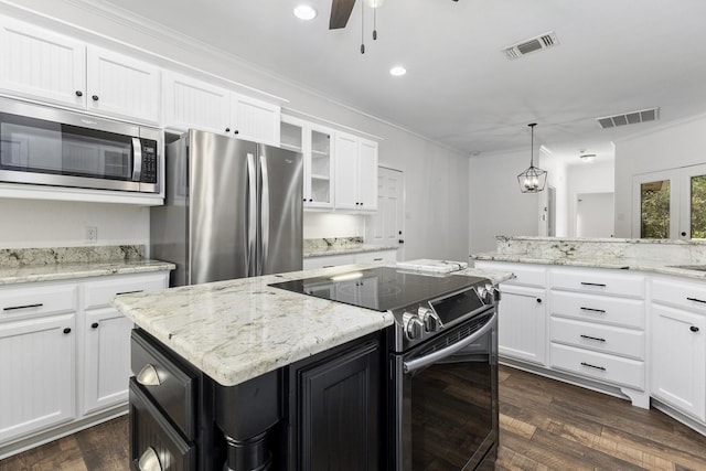 kitchen featuring visible vents, appliances with stainless steel finishes, and dark wood finished floors