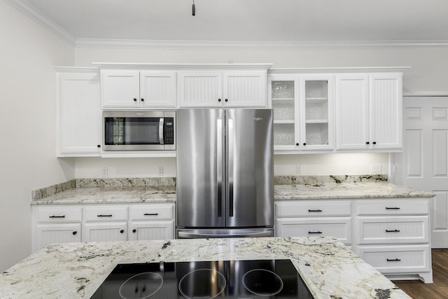 kitchen featuring white cabinets, appliances with stainless steel finishes, dark wood finished floors, glass insert cabinets, and crown molding