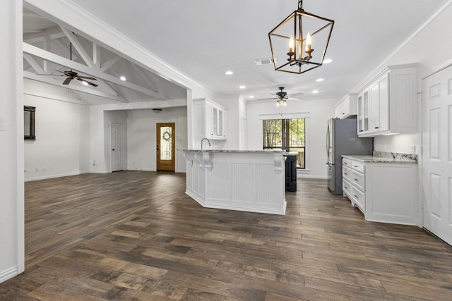 kitchen with white cabinets, glass insert cabinets, and open floor plan