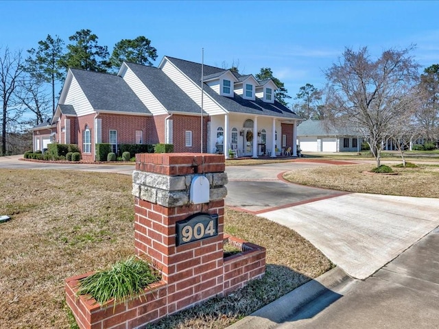 exterior space featuring a yard and driveway