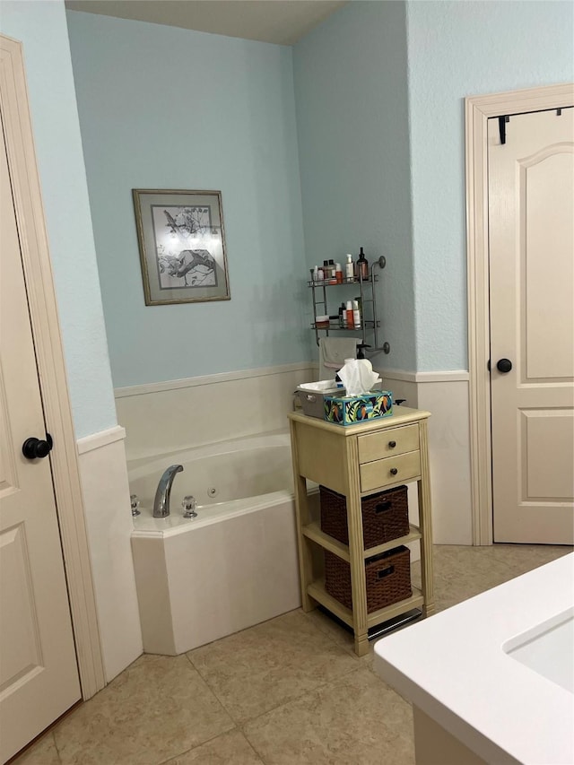 full bathroom featuring a whirlpool tub and tile patterned floors