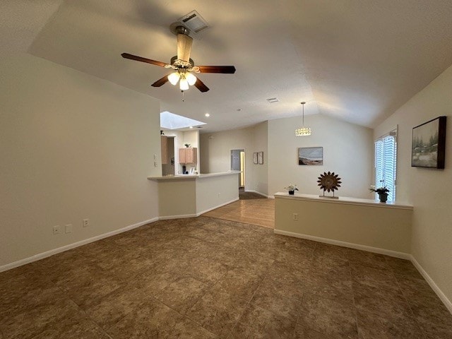 unfurnished living room featuring lofted ceiling, visible vents, ceiling fan, and baseboards