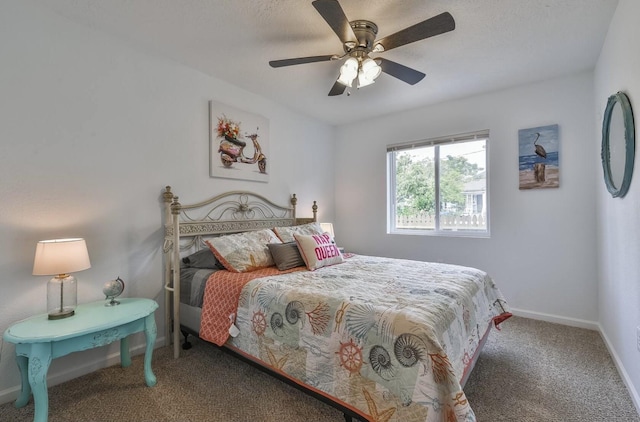 carpeted bedroom featuring a ceiling fan and baseboards