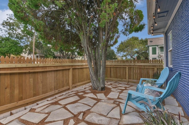 view of patio / terrace featuring fence