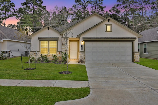 view of front of property with an attached garage, central AC, stone siding, driveway, and a front lawn