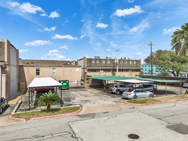 view of property featuring covered parking