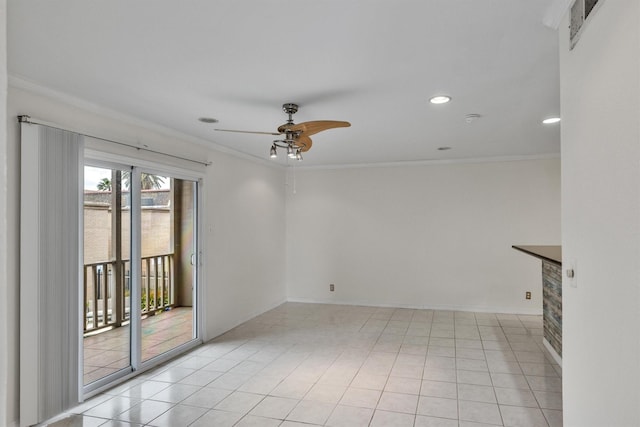 empty room featuring visible vents, ornamental molding, ceiling fan, and light tile patterned flooring