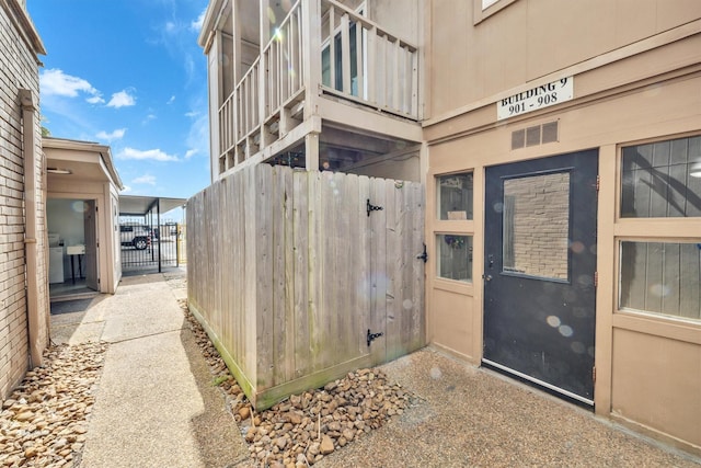 property entrance with a gate and fence