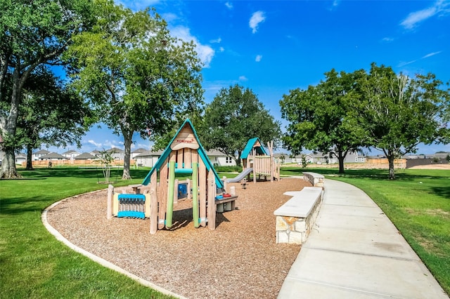 community play area with a lawn