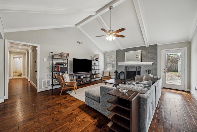 living room featuring visible vents, beamed ceiling, hardwood / wood-style flooring, and baseboards