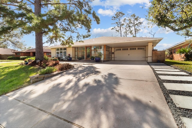 single story home with driveway, an attached garage, a front lawn, and stucco siding