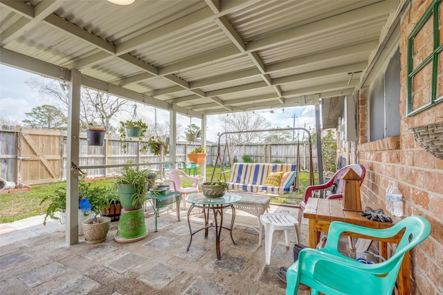 exterior space featuring fence and an outdoor hangout area