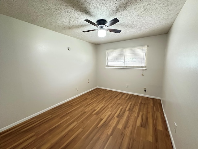 11439 Sageking Dr, Houston, TX 77089 - unfurnished room with wood finished floors, baseboards, ceiling fan, and a textured ceiling