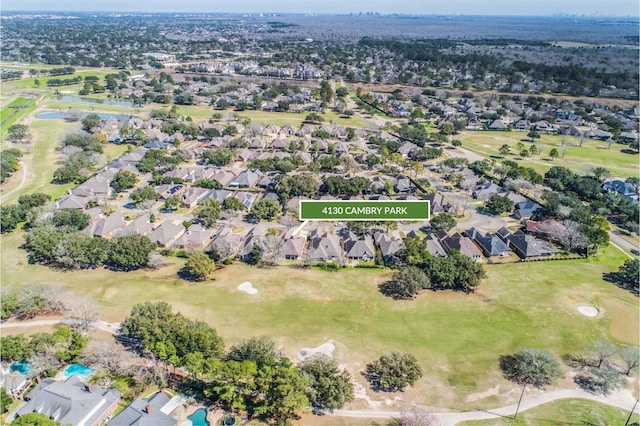 birds eye view of property with a residential view and golf course view