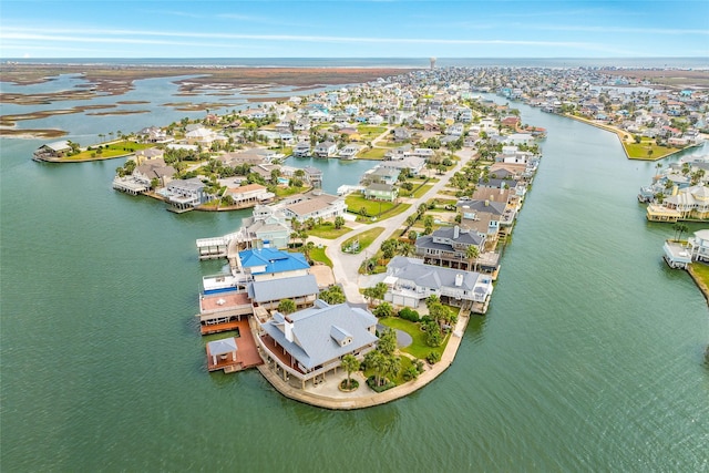 drone / aerial view featuring a water view and a residential view