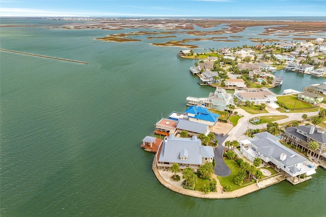 drone / aerial view with a residential view and a water view