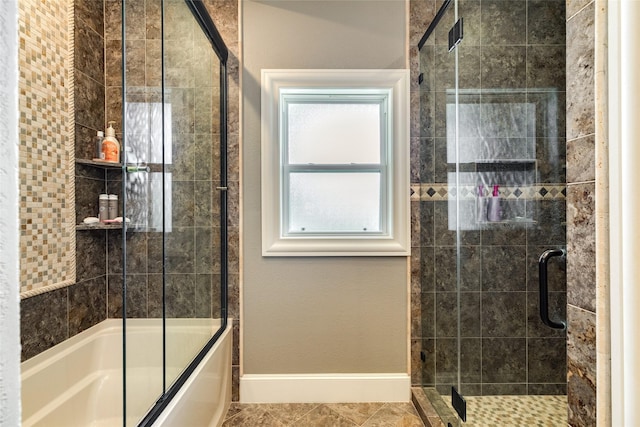 bathroom with tiled shower / bath and baseboards