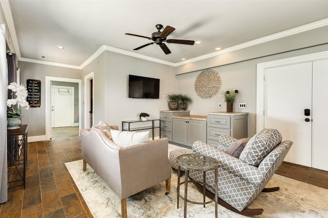 living area featuring dark wood-style flooring, recessed lighting, ornamental molding, ceiling fan, and baseboards