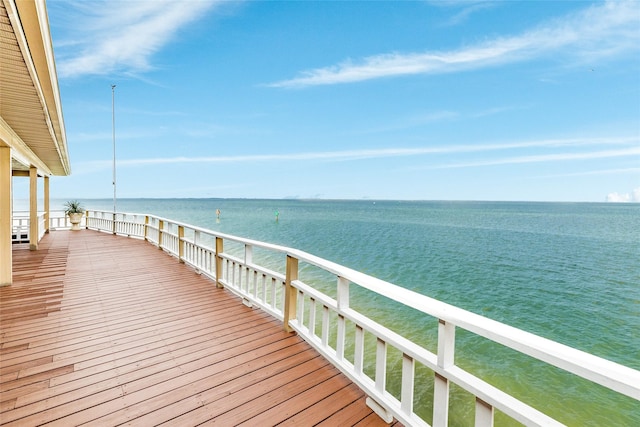 wooden deck with a water view