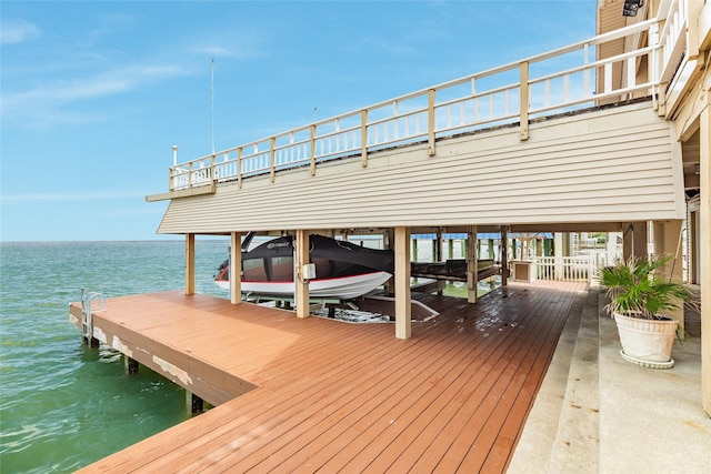 view of dock featuring a water view and boat lift