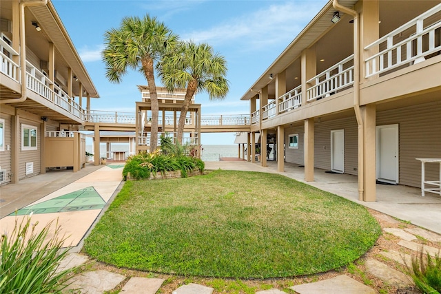 view of yard with shuffleboard