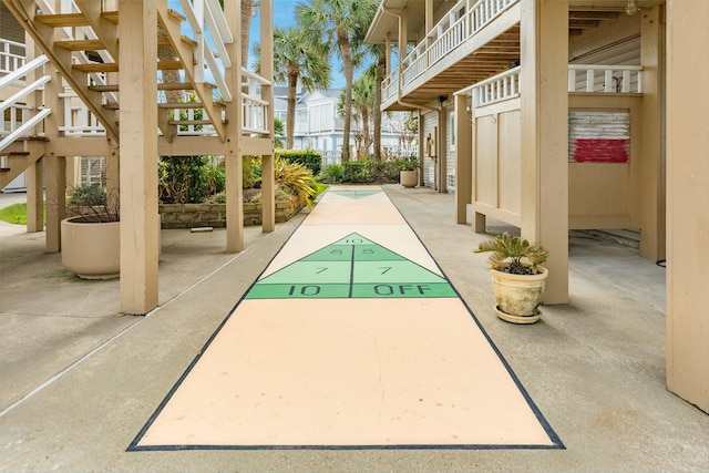 view of home's community featuring shuffleboard