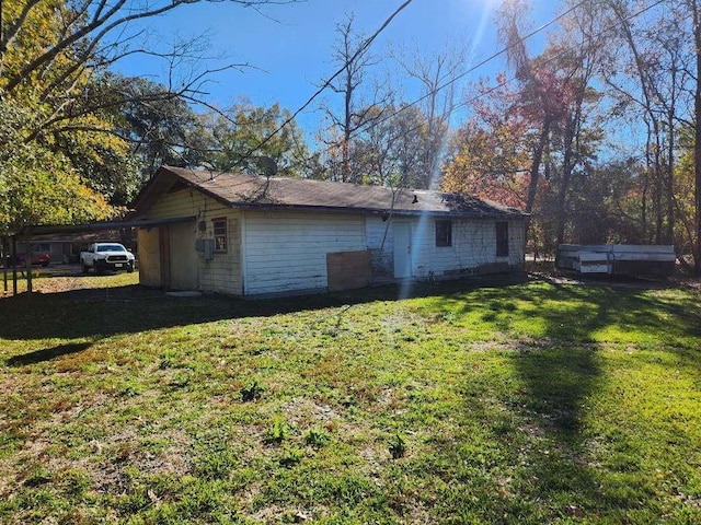 view of home's exterior with a yard