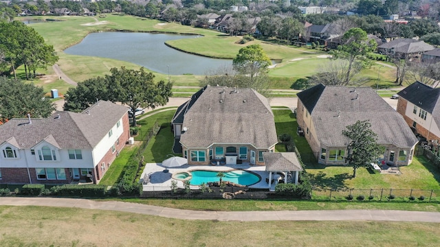 birds eye view of property with a water view, a residential view, and golf course view