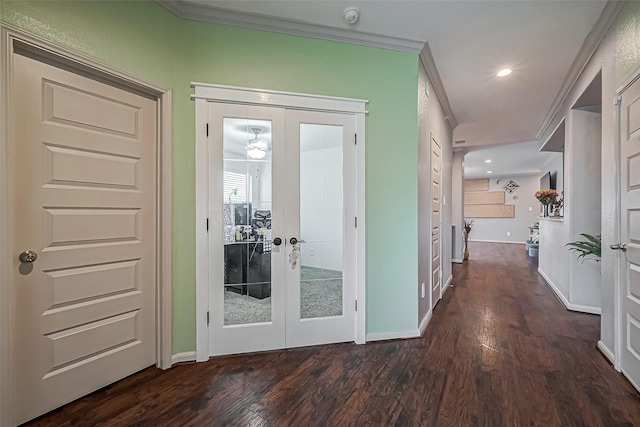 doorway to outside with ornamental molding, french doors, dark wood-style flooring, and baseboards