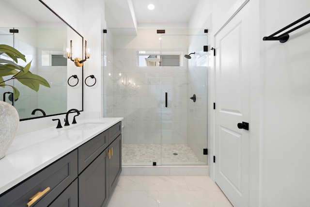 full bathroom with a stall shower, marble finish floor, vanity, and recessed lighting