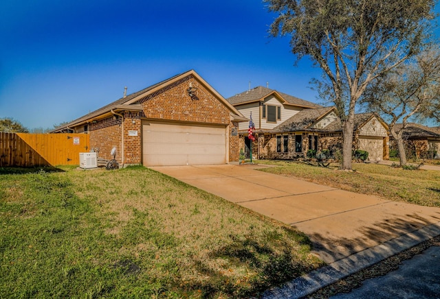 view of front facade featuring an attached garage, brick siding, fence, concrete driveway, and a front yard