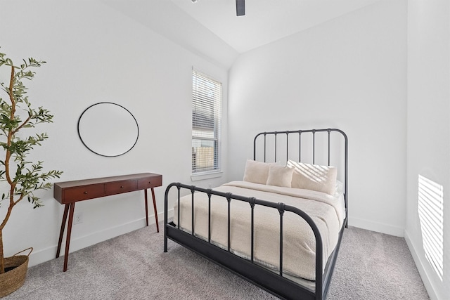 bedroom featuring carpet floors, vaulted ceiling, ceiling fan, and baseboards