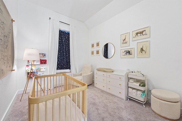 bedroom with carpet floors, a nursery area, and baseboards