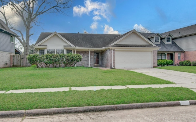 view of front of house featuring brick siding, concrete driveway, fence, a garage, and a front lawn