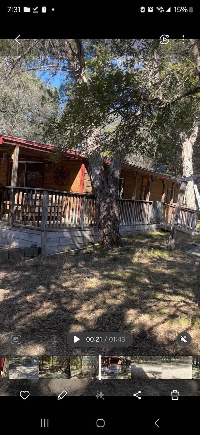 view of yard with covered porch