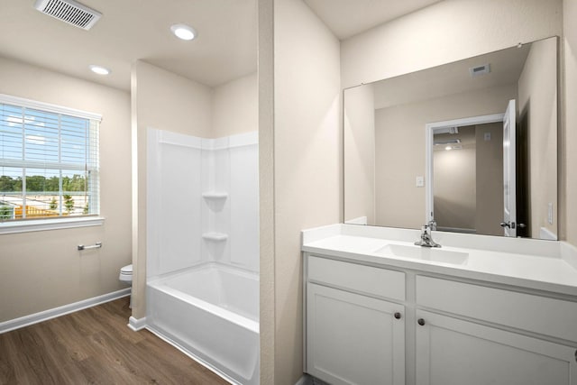 full bathroom featuring visible vents, vanity, toilet, and wood finished floors