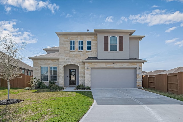 view of front of house with driveway, an attached garage, fence, a front lawn, and stucco siding