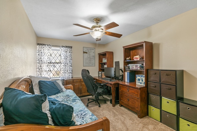 office area with light colored carpet and ceiling fan