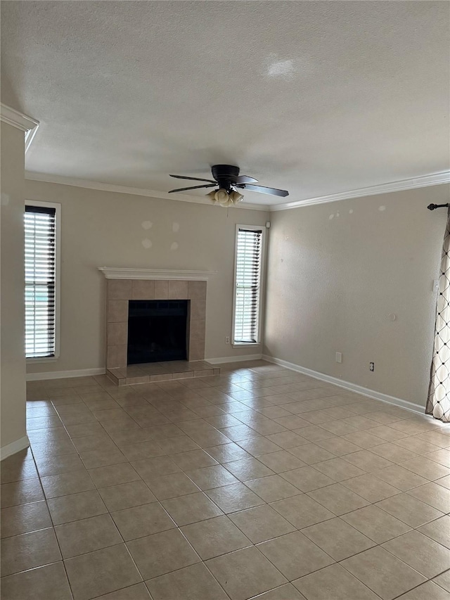 unfurnished living room featuring a fireplace, crown molding, a textured ceiling, and ceiling fan